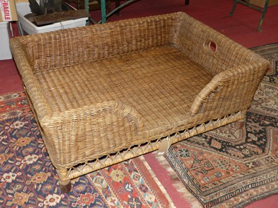 Lot 1276 - A wicker freestanding rectangular twin handled...