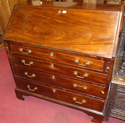 Lot 1280 - A George III mahogany slopefront chest,...