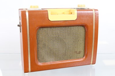 Lot 566 - A vintage Eveready portable radio, together...