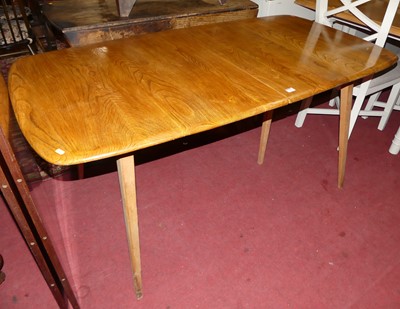 Lot 1288 - A 1960s Ercol elm extending dining table,...