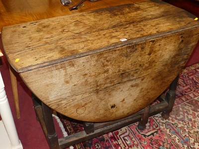 Lot 1293 - An 18th century joined oak dropleaf dining...