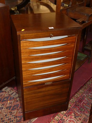 Lot 1304 - A mid-20th century teak tambour fronted office...