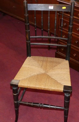 Lot 1319 - An early 20th century beech and rushseat...