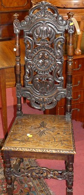 Lot 1321 - An early 20th century heavily carved oak...