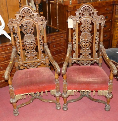 Lot 1324 - A pair of late 19th century heavily carved and...