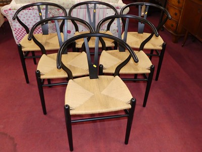 Lot 1325 - After Hans Wegner - a set of six black painted...