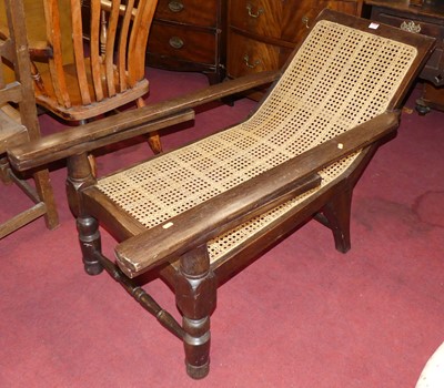 Lot 1330 - A hardwood and cane inset plantation chair,...