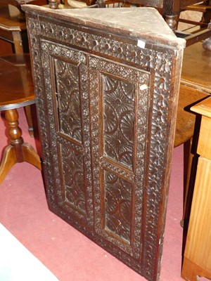 Lot 1359 - A heavily floral relief carved oak hanging two...