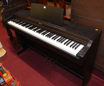 Lot 1361 - A Roland electric upright piano