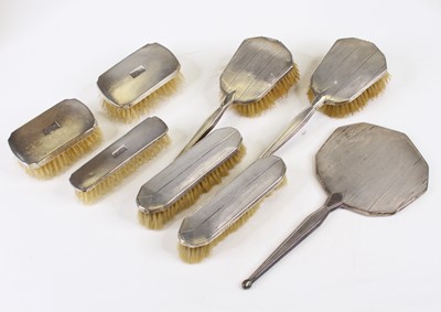 Lot 281 - An Art Deco silver clad brush set, together...