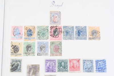 Lot 563 - A collection of stamps housed in four albums...