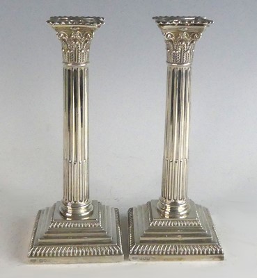 Lot 2121 - A pair of Edwardian silver candlesticks, of...