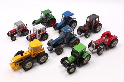 Lot 1937 - A collection of 9 various Britains Tractors,...