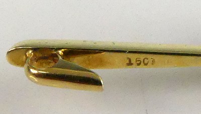 Lot 2554 - A yellow metal amethyst bar brooch, having a...