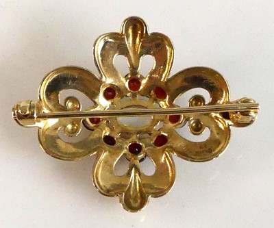 Lot 2555 - A 9ct yellow gold, opal and garnet Celtic...