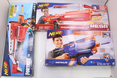 Lot 1601 - A collection of three various boxed Nerf  guns...