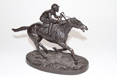Lot 38 - A bronze figure of a mounted jockey, on an...