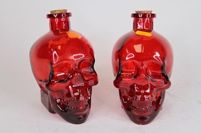 Lot 43 - A pair of cranberry glass decanters in the...