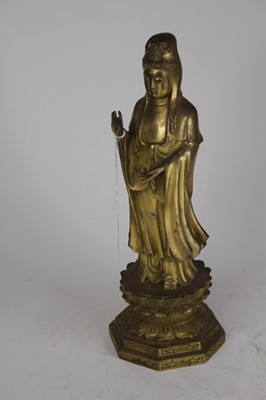 Lot 45 - A gilt metal figure of Guanyin, h.27.5cm
