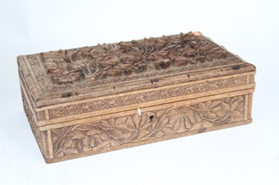 Lot 55 - An eastern carved hardwood table cigarette box,...