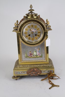 Lot 56 - A Napoleon III style brass cased mantel clock,...