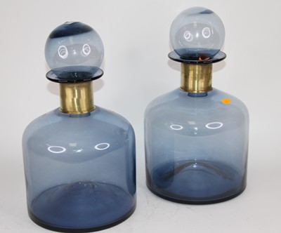 Lot 57 - A pair of large blue glass bottles and...