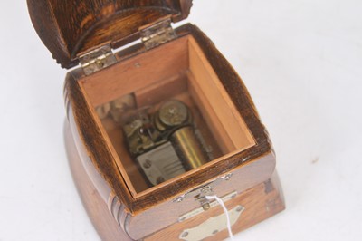 Lot 61 - An early 20th century oak music box in the...