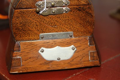 Lot 61 - An early 20th century oak music box in the...