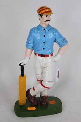 Lot 66 - A painted cast iron figure of a cricketer,...