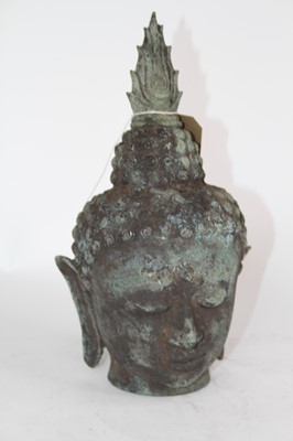 Lot 52 - A verdigris metal Buddha's head, h.30cm
