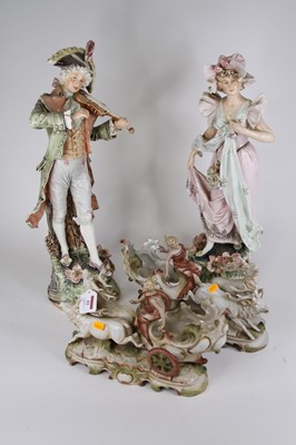 Lot 53 - A pair of continental pottery figures of a...