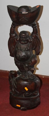 Lot 117 - An Asian carved hardwood figure of Buddha, h.71cm