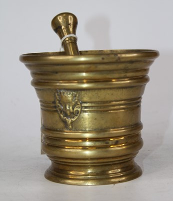 Lot 212 - A cast brass pestle and mortar, in the 17th...