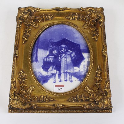 Lot 129 - A blue and white pottery wall plaque,...