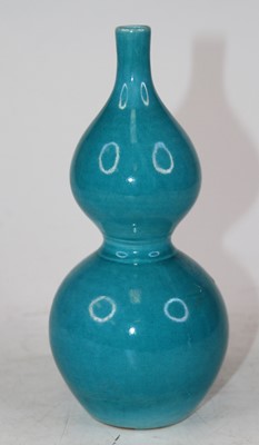 Lot 219 - A Chinese turquoise glazed double gourd...