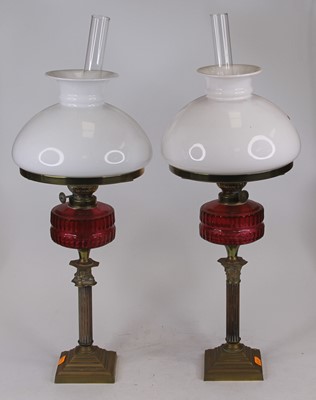 Lot 135 - A pair of Victorian brass oil lamps, each...