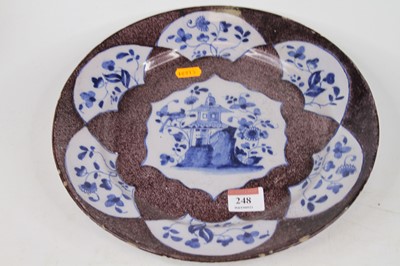 Lot 248 - An 18th century Engish delft charger, having a...