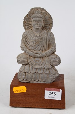 Lot 255 - An Indian clay Buddha amulet, Gandharan form,...