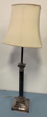 Lot 169 - A plated metal table lamp in the form of a...