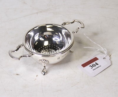 Lot 304 - An Elizabeth II silver strainer, Birmingham...