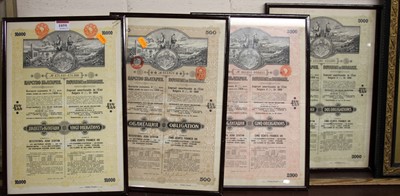 Lot 1059 - Four framed bond certificates, as published in...