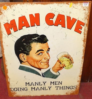 Lot 1110 - A printed tin sign 'Man cave', 70 x 50cm