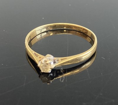 Lot 359 - An 18ct gold diamond solitaire ring, the claw...