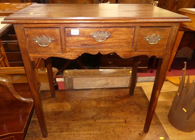 Lot 1168 - A George III mahogany three-drawer low boy,...