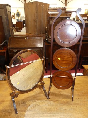 Lot 1172 - A 1930s mahogany circular three-tier folding...