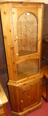 Lot 1174 - A modern pine freestanding corner cupboard