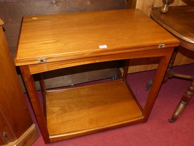 Lot 1176 - A 1970s teak folding two-tier tea trolley,...