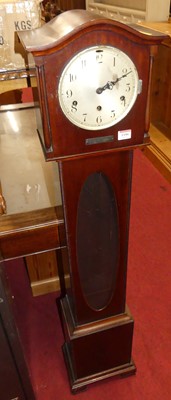 Lot 1186 - A 1930s mahogany grandmother clock, having...