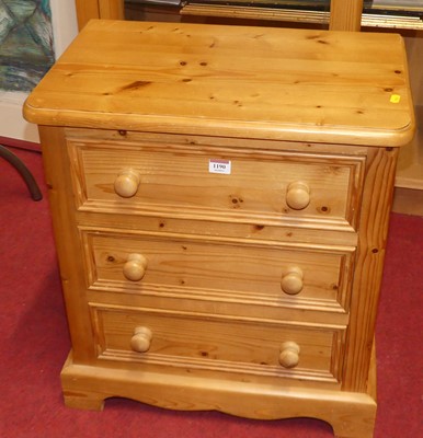 Lot 1190 - A modern pine round cornered three-drawer...