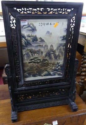 Lot 1191 - A contemporary Chinese pierced, ebonised, and...